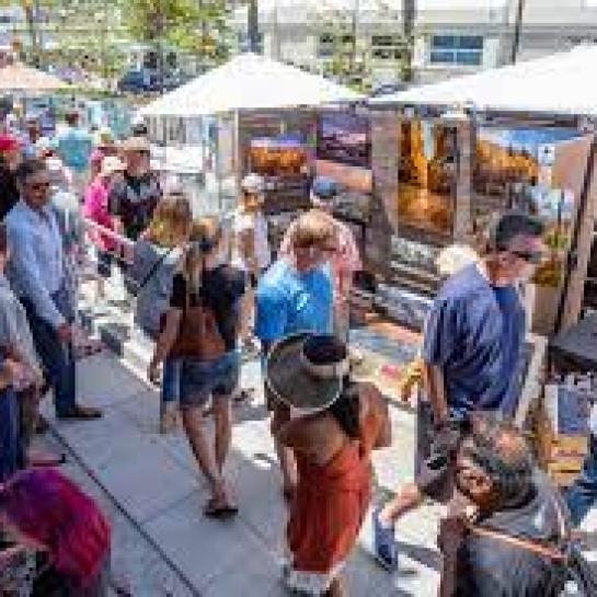 People enjoying outdoor art exhibits