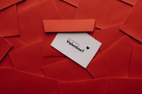 Will You Be My Valentine? invitation on red background