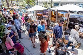 People enjoying outdoor art exhibits