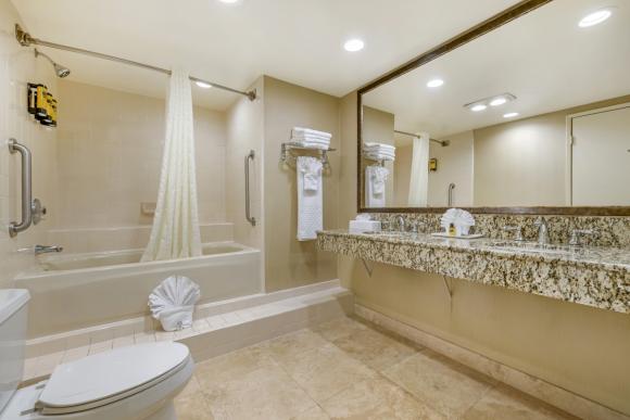 Doheny Suites-Queen/Queen section bathroom with double sink and raised bathtub